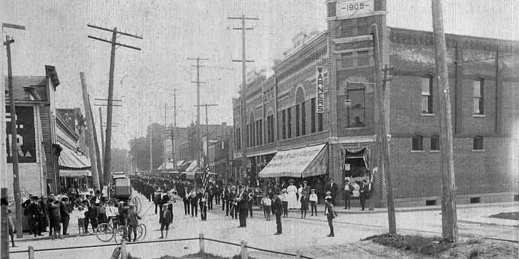 Marching band playing down Main St