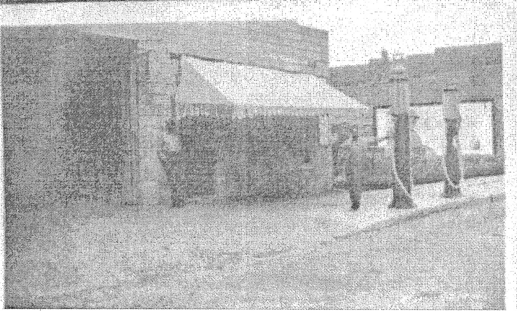 Robert March in front of Dixie Garage