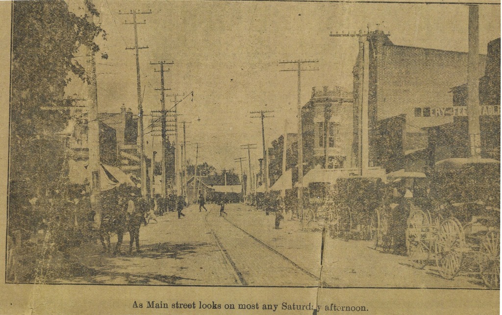 Old newspaper picture showing a length of street in downtown Summitville, IN